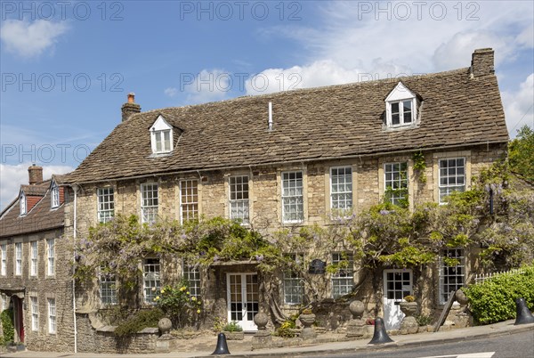 Historic stone buildings in village of Norton St Philip, Somerset, England, UK