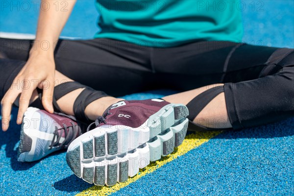 Young sportswoman wears running shoes from the Swiss shoe brand ON