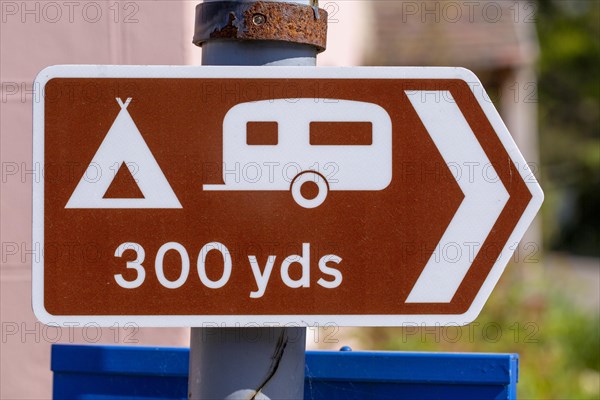 Macro close-up of direction sign for campsite, Shottisham, Suffolk, England, UK
