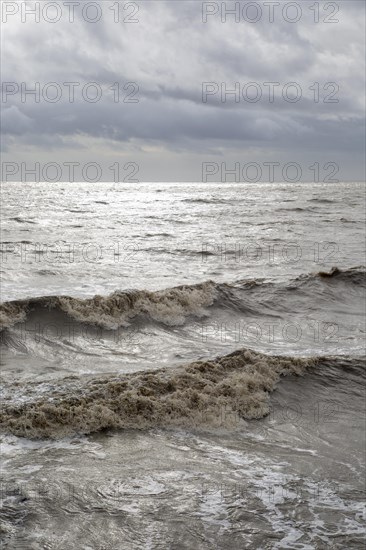 Dark storm clouds waves choppy water, North Sea, Bawdsey, Suffolk, England, UK