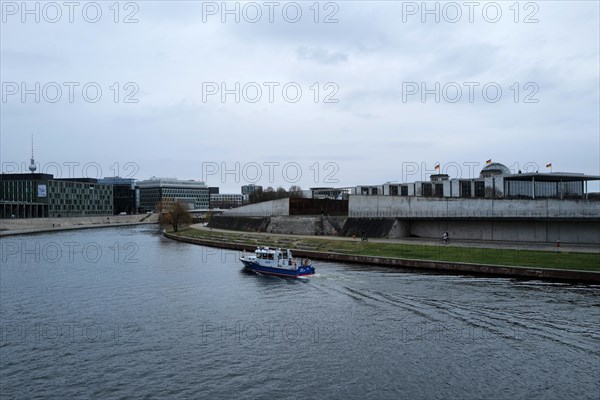 A police boat travels up the River Spree close to the German Bundestag building on a day of widespread protests. Berlin, Germany, Europe