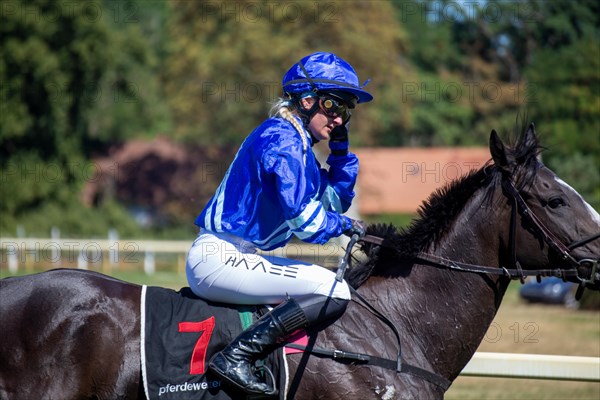 Race day at the racecourse in Hassloch, Palatinate. Galloping out after the Mueller Bau GmbH Prize (category E, 1, 400 metres) . Here is the winner Lilli-Marie Engels on Raquelle