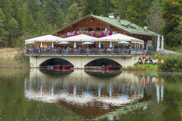 Pflegersee with inn under a cloudy sky, Garmisch-Partenkirchen, Werdenfelser Land, Upper Bavaria, Bavaria, Germany, Europe