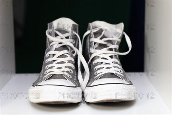 Grey Chucks on a shelf