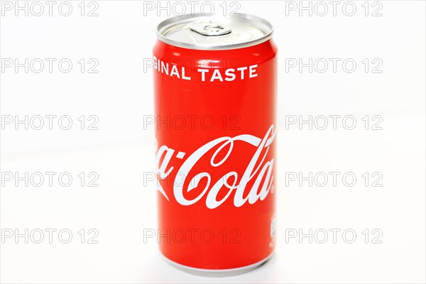 Coca-Cola can in front of a white background