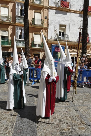 Semana Santa, procession with Nazarenos and tourists, celebrations in Cadiz, Spain, Europe