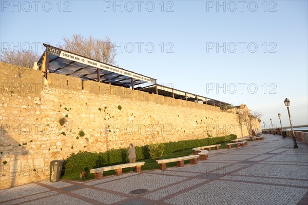 City walls of fortified medieval old town, Cidade Velha, from the waterfront city of Faro, Portugal, Europe
