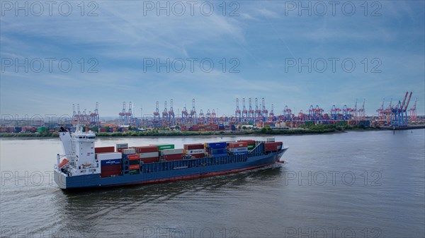 Cargo ship for containers in Hamburg harbour, behind it crane facilities, Hanseatic City of Hamburg, Hamburg, Germany, Europe