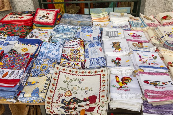 Display of tea towel textile souvenir products of butterflies and fish on sale, city of Evora, Alto Alentejo, Portugal, southern Europe, Europe