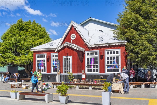 Historic red wooden house and street vendors with their displays, Ushuaia, Tierra del Fuego Island, Patagonia, Argentina, South America