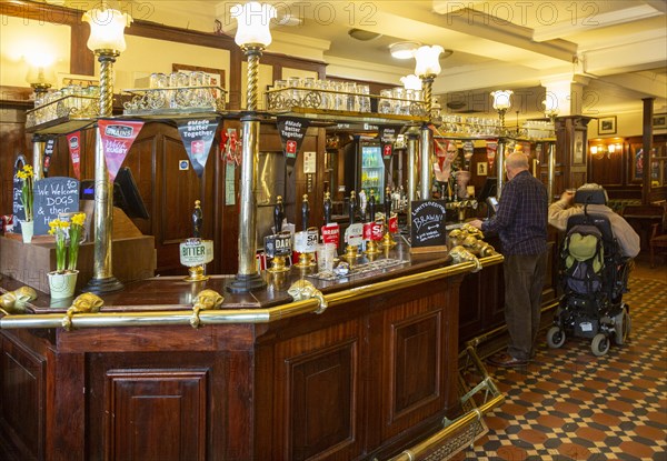 Interior of historic Goat Major pub in city centre of Cardiff, South Wales, UK, bar with Brains beers on sale