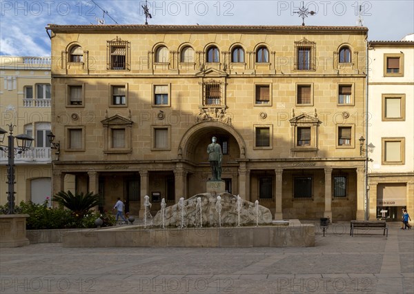 Statue wearing face mask in front of Santander bank, Plaza Andalucia, Ubeda, Spain, Europe