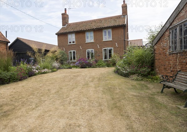 Grass lawn parched dry by long summer drought in 2018 Shottisham, Suffolk, England, UK