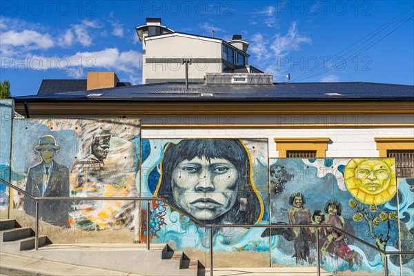 Street art wall with images of the indigenous Yaghan people, Ushuaia, Tierra del Fuego Island, Patagonia, Argentina, South America