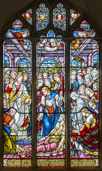 Stained glass window by Alexander Gibbs c 1895, Jesus healing the sick man, Aldringham church, Suffolk, England, UK