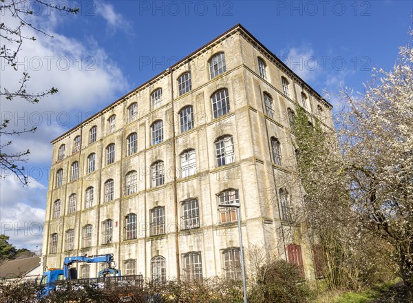 Nineteenth century five storey high historic Ashton Mills industrial mill building, Trowbridge, Wiltshire, England, UK