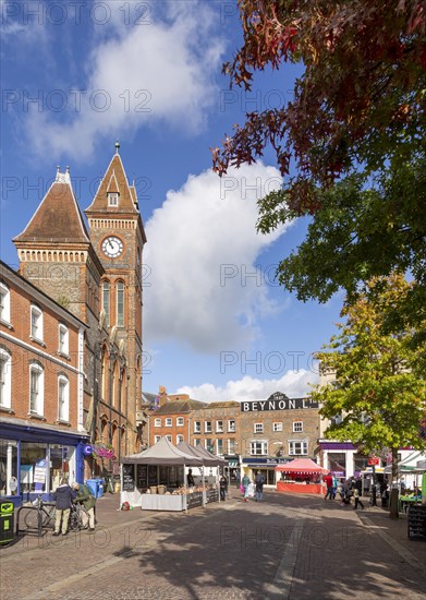 Clock tower of town hall and historic buildings in Market Place, Newbury, Berkshire, England, UK