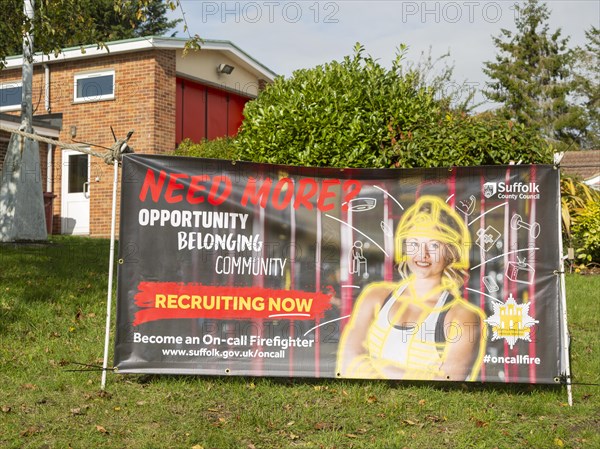 Recruitment advertising poster for on-call firefighters, Holbrook, Suffolk, England, UK