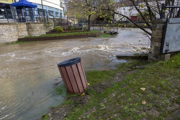 River Marden high water level after winter rain, Calne town centre, Wiltshire, England, UK