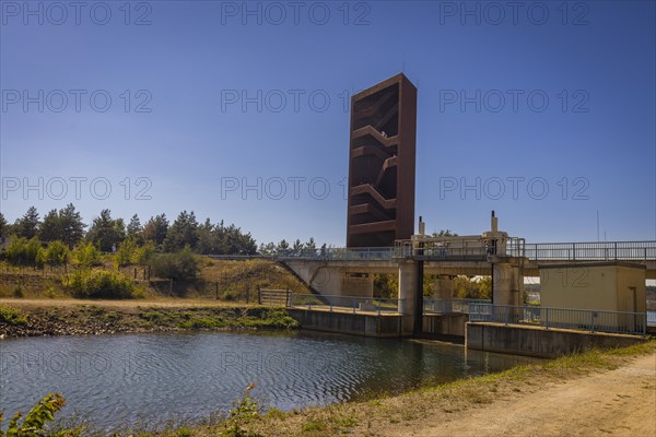 The 30 metre high landmark of the Lusatian Lakeland, the so-called Rusty Nail, was built at the mouth of Lake Sedlitz. It is a lookout tower made of 111 tonnes of Corten steel, with the base of a right-angled triangle with cathetus lengths of approximately twelve and eight metres. 162 steps lead to the viewing platform on the tower, Senftenberg, Brandenburg, Germany, Europe