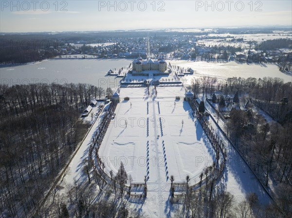 Moritzburg Castle on the castle island surrounded by the frozen castle pond, Moritzburg, Saxony, Germany, Europe