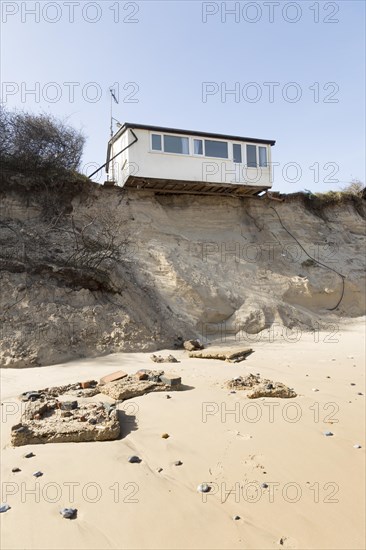 March 2018, Clifftop property collapsing due to coastal erosion after recent storm force winds, Hemsby, Norfolk, England, UK