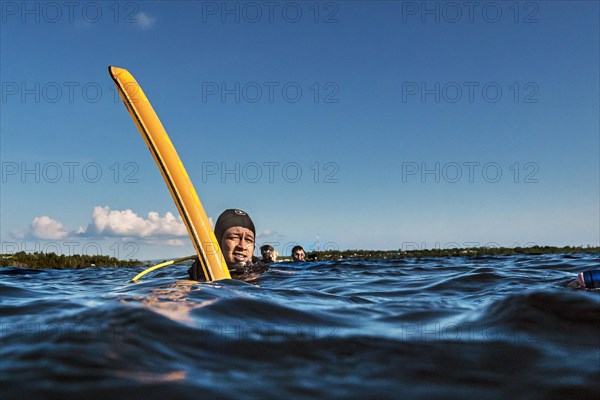 Dive guide with dive buoy, Wakatobi Dive Resort, Sulawesi, Indonesia, Asia