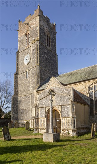 Tower and porch of village church of Saint Michael Tunstall, Suffolk, England, UK
