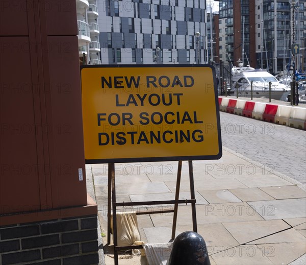Sign for new road layout for social distancing, Wet Dock waterfront, Ipswich, Suffolk, England, UK July 2020