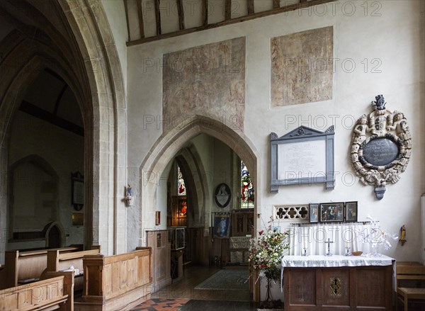 Medieval wall paintings and wall memorial monuments in side chapel of the church of Saint Mary, Purton, Wiltshire, England, UK