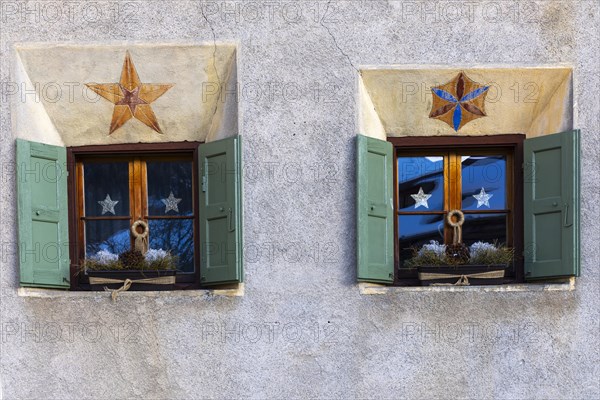 Windows on historic house, sgraffito, facade decorations, shutters, Guarda, Engadin, Grisons, Switzerland, Europe