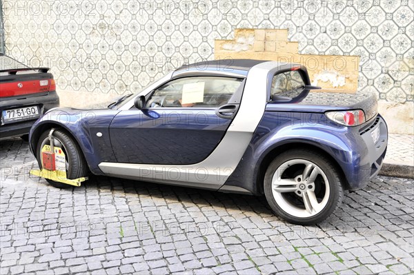 Car with police claw, Parking in no parking zone, Lisbon, Lisboa, Portugal, Europe