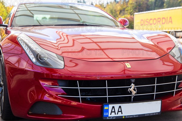 Close-up of a red Ferrari FF (seen at the Ellwanger Berge motorway service area, Baden-Wuerttemberg, Germany)