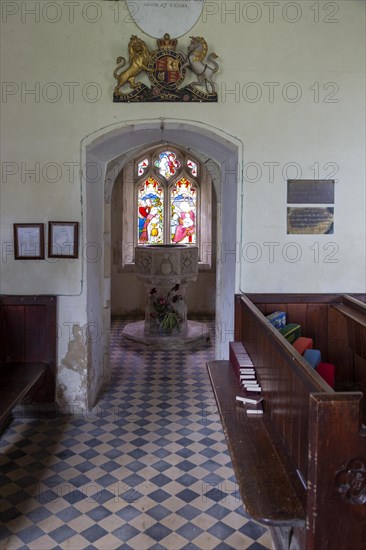 Historic interior of Washbrook church, Suffolk, England, UK, baptistery doorway