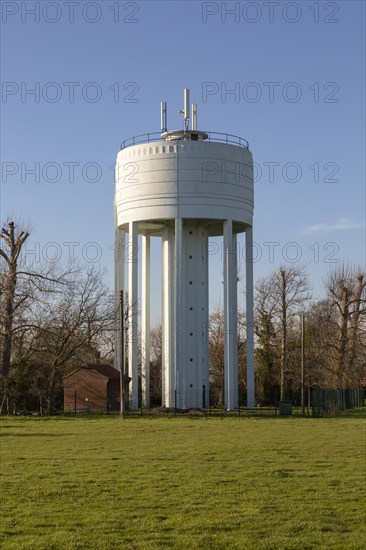 White concrete water storage tower at St Michael South Elmham, Suffolk, England, UK