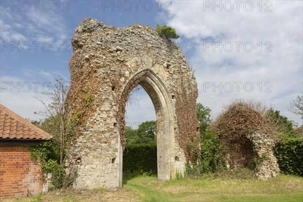 Ruined stone arch of abbey church, Butley priory, Suffolk, England, UK