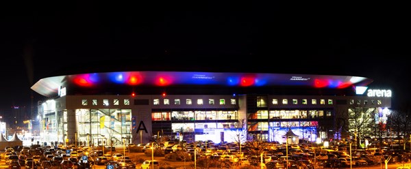 Night shot of the brightly lit SAP Arena in Mannheim at an Adler Mannheim home game