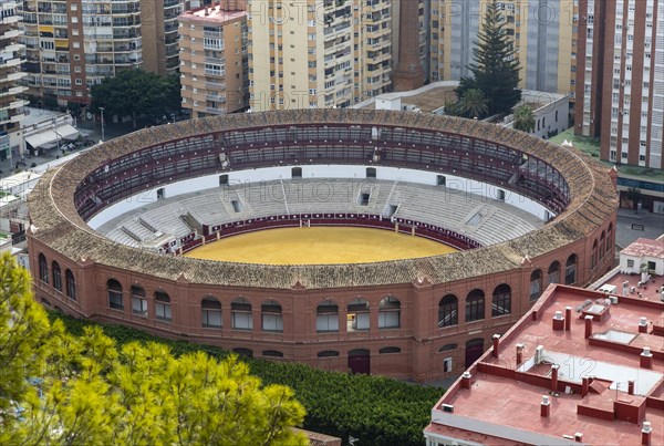 Historic bullring in city of Malaga surrounded by high rise apartments, Malaga, Andalusia, Spain, Europe