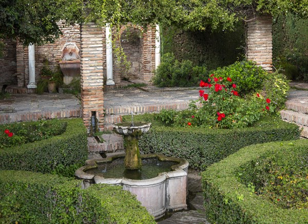 Water fountain in garden of historic Moorish palace Alcazaba, Malaga, Andalusia, Spain, Europe