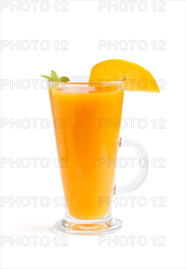 Glass of peach juice isolated on white background. Morninig, spring, healthy drink concept. Side view, close up