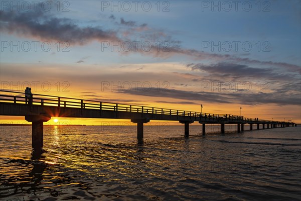 Sunset on the beach of Prerow on the Darss at the pier