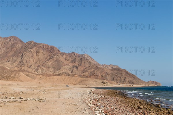 The coastline of the Red Sea and the mountains in the background. Egypt, the Sinai Peninsula, Dahab