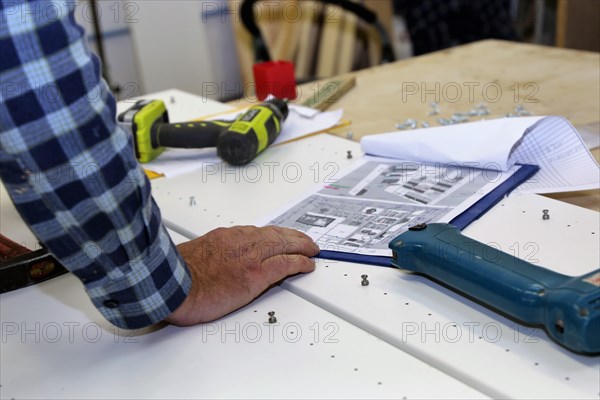 Carpenter at work in his carpentry workshop