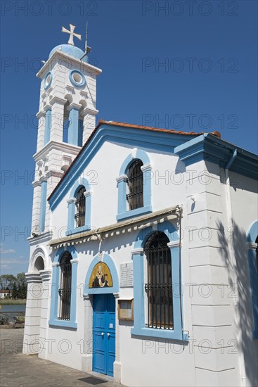 A white church with blue sky and decorative tower, Monastery of St Nicholas, Monastery of Agios Nikolaos, Agiou Nikolaou, Vistonidas Burma Lagoon, Porto Lagos, Xanthi, Eastern Macedonia and Thrace, Greece, Europe