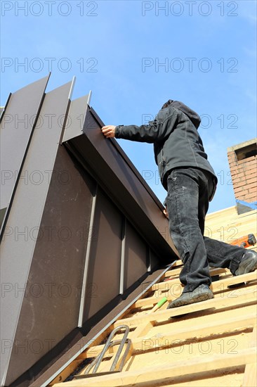 Roofer working on a new dormer window