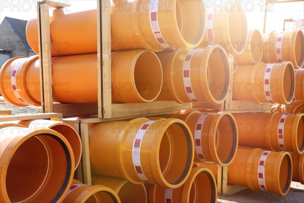 Stack of KG pipes on a construction site in the Mutterstadt development area, Rhineland-Palatinate