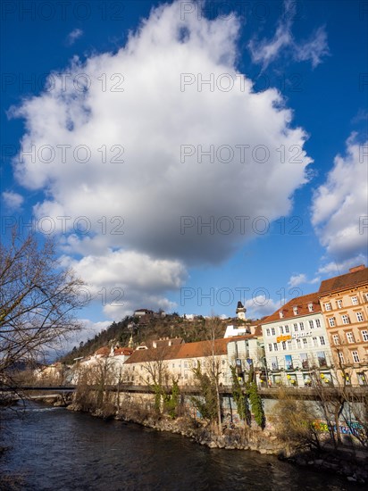 View over the river Mur to the Schlossberg with clock tower, Graz, Styria, Austria, Europe
