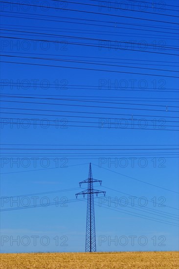 A high-voltage pylon with many high-voltage lines above it