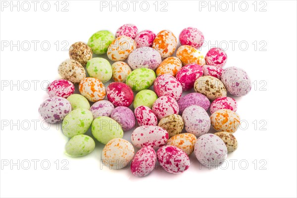 Pile of multicolored candies isolated on white background, chocolate dragees. close up, side view