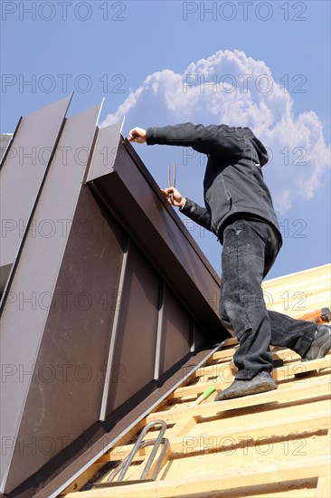 Roofer working on a new dormer window